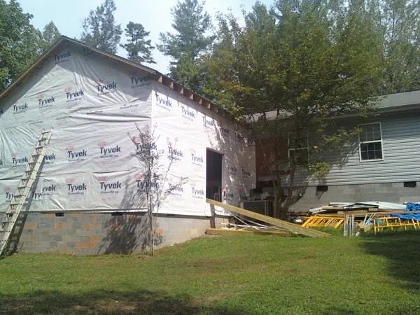 Tyvek wrapped gable on a new room addition beside an existing home in Butler